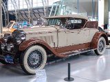 1929 Packard  Autoworld is a vintage car museum in the center of Brussels, Belgium, located in the southern hall of the Cinquantenaire Park.  It holds a large and varied collection of 350 vintage European and American automobiles from the late 19th century until the seventies. Including Minervas, such models as a 1928 Bentley, a 1930 Bugatti and a 1930 Cord and several limousines which belonged to the Belgian royal family.
