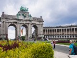 DSC7646  Arcade du Cinquantenaire is a monumental triple arch in the center of the Cinquantenaire park in. It is topped by a bronze quadriga sculptural group with a woman charioteer, representing Brabant raising the national flag. The columns echo the original layout of Avenue de Tervuren, which was once divided into three roadways lined with a double row of trees