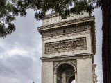 IMG 3929 1  Side view of le Arc de Triomphe de l'Étoile (Triumphal Arch of the Star) in Paris which stands in the centre of the Place Charles de Gaulle at the western end of the Champs-Élysées. The monument honours those who fought and died for France in the French Revolutionary and the Napoleonic Wars, with the names of all French victories and generals inscribed on its inner and outer surfaces. Beneath its vault lies the Tomb of the Unknown Soldier from World War I.
